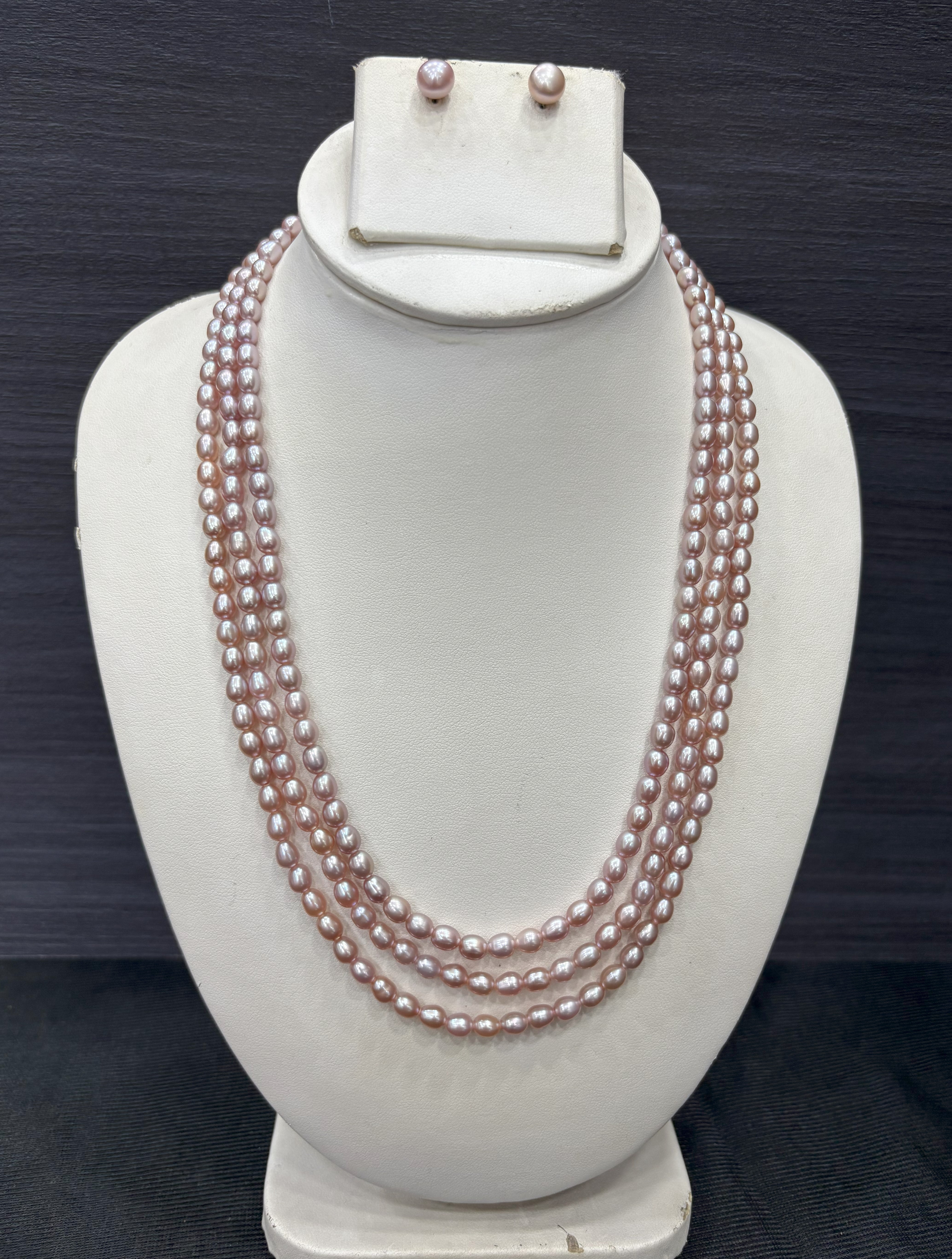 Multi-strand pearl necklace and earrings